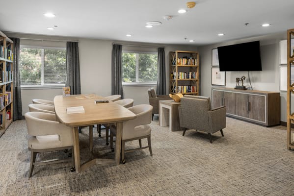 Cozy common area with seating and bookshelves