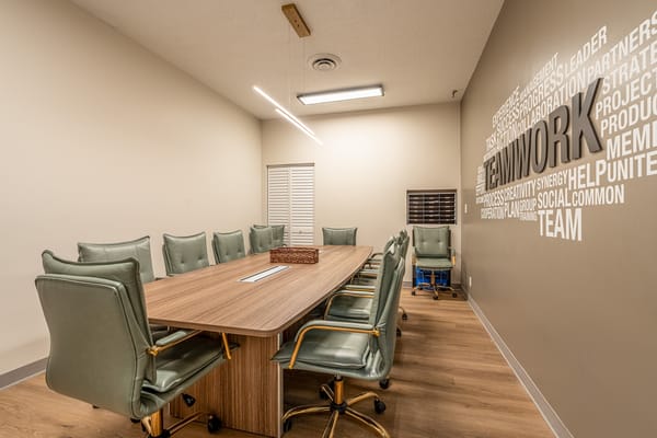 Interior meeting room with a large table and chairs