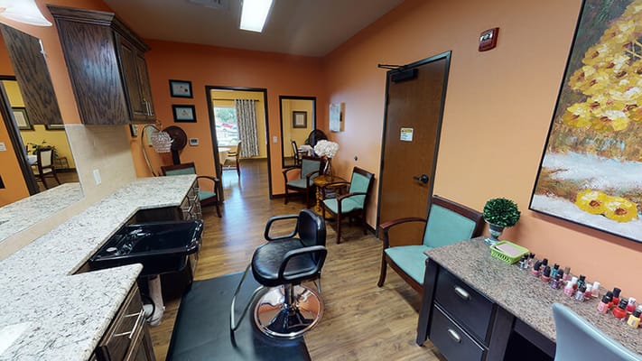 Beauty salon area with styling chairs and nail polish