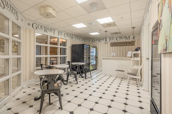 Interior view of an ice cream area with seating