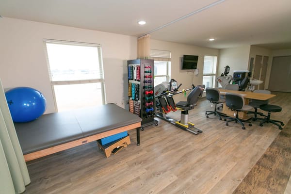 Interior view of a therapy room with equipment