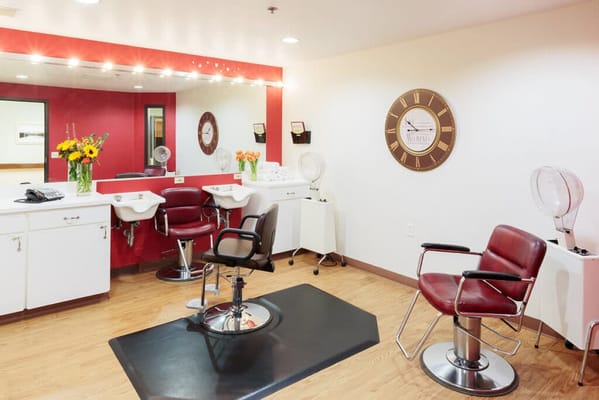 Beauty salon interior with styling chairs and mirrors