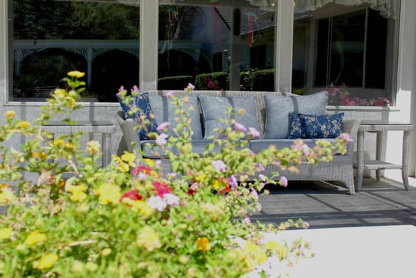 Outdoor seating area adorned with flowers