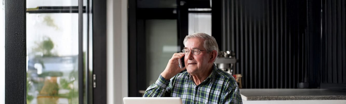 A resident on the phone in a well-lit common area