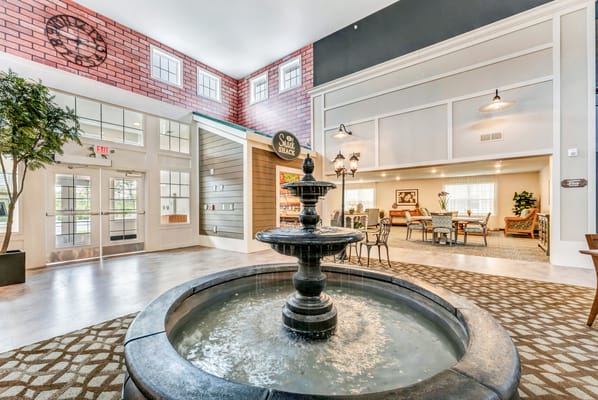 Interior view of a welcoming common area with a fountain