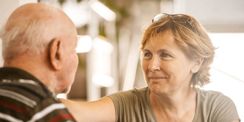 Caregiver engaging with a senior resident