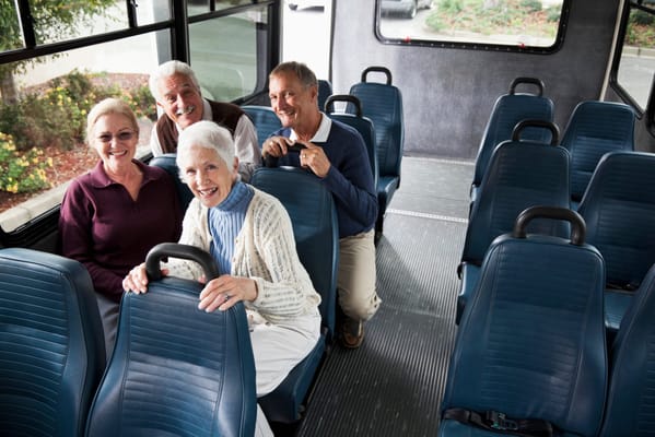 Residents enjoying a ride on facility transport