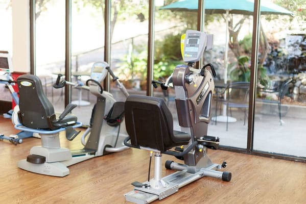 Exercise equipment in a well-lit activity room