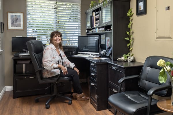 Staff member in an office at the assisted living facility