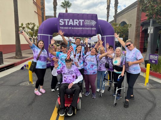 Participants in a fundraising walk for Alzheimer's awareness