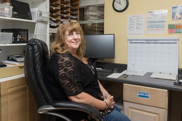 Staff member in an office at the facility