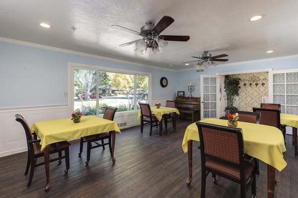 Dining area with bright tables and chairs