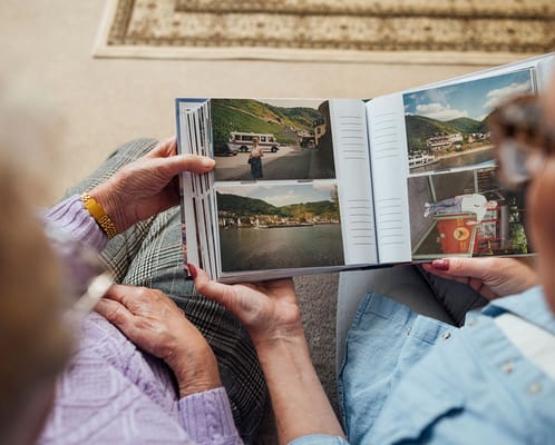 Two residents looking at a photo album together