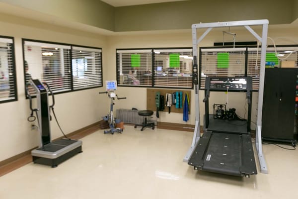 Interior view of a rehabilitation therapy room with equipment