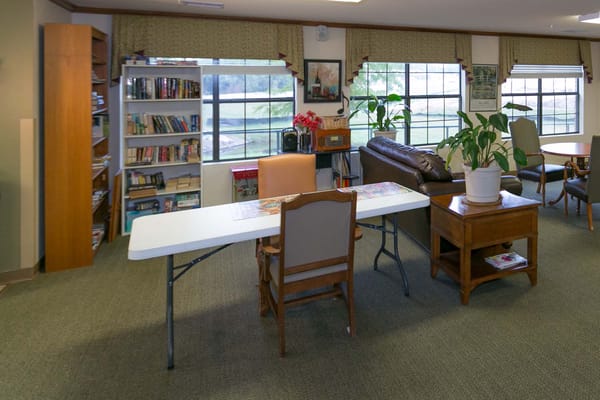 Common area with bookshelves and seating