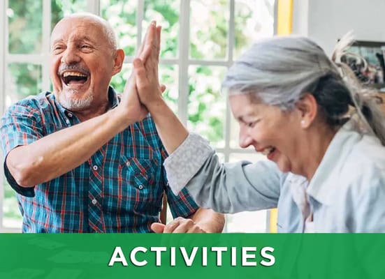 Two seniors participating in an activity with laughter