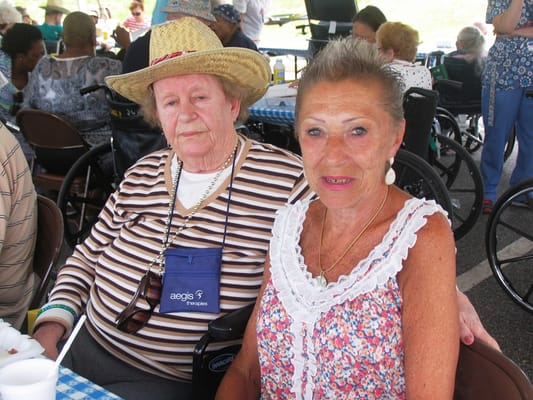 Two residents enjoying a social event outdoors