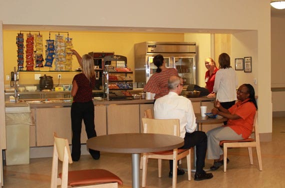 Residents enjoying snacks in a dining area
