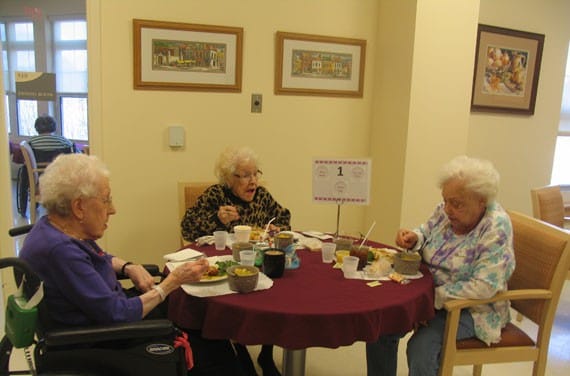 Residents enjoying a meal in the dining room