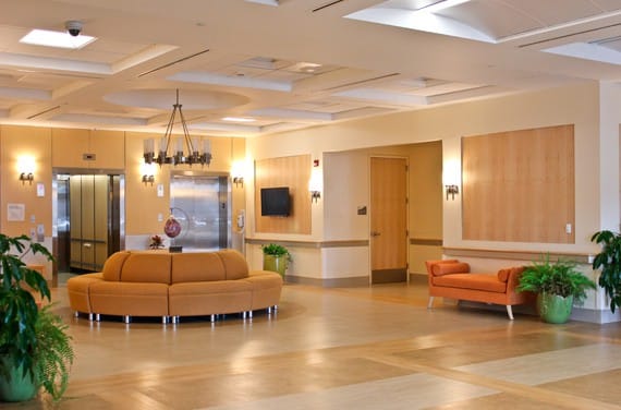 Bright interior common area with seating and plants