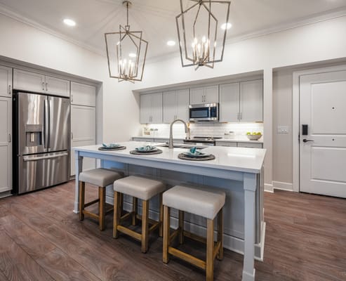 Bright, modern kitchen interior with seating