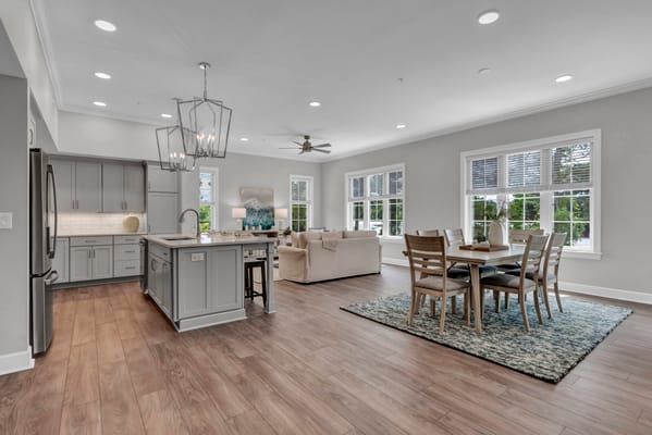 Bright and spacious common area with dining table