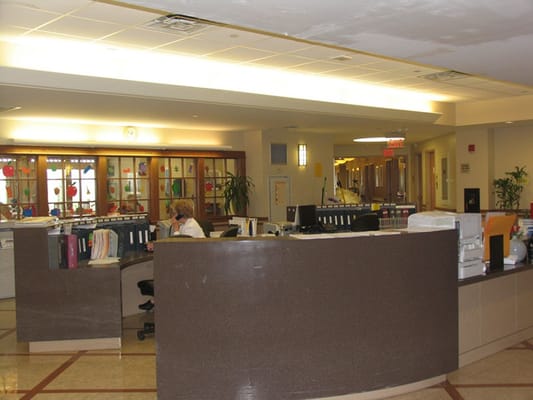 Reception area with staff attending to paperwork
