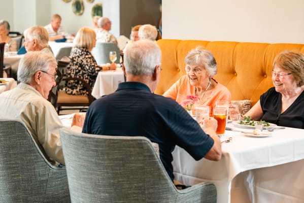 Residents enjoying a meal in the dining room