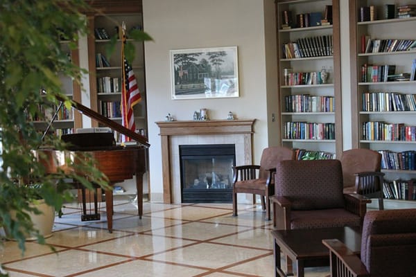 Cozy library area with bookshelves and seating