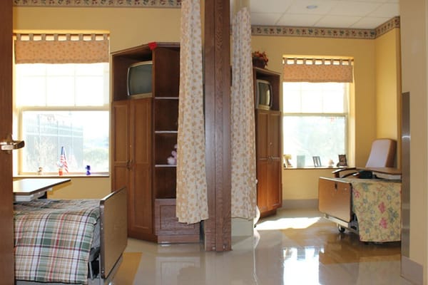 Private resident room with furnishings and windows