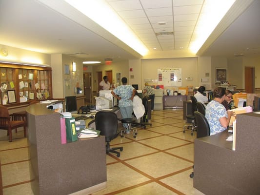 Staff members working in a facility office area