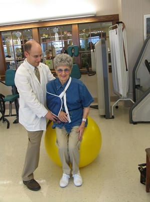 Therapist assisting a resident during an activity session