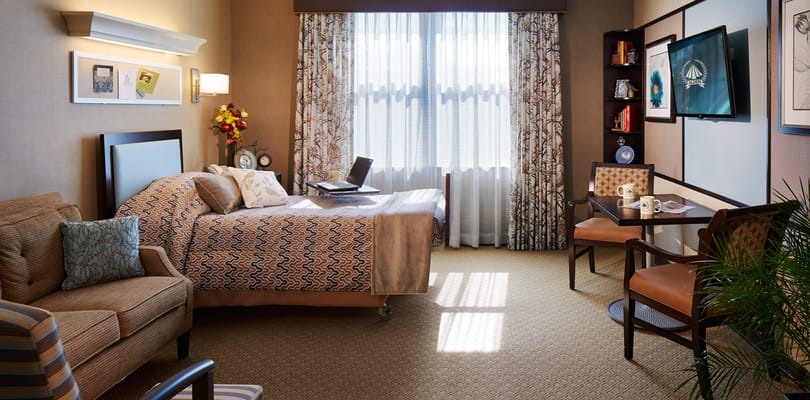 Cozy resident room with comfortable seating and decor