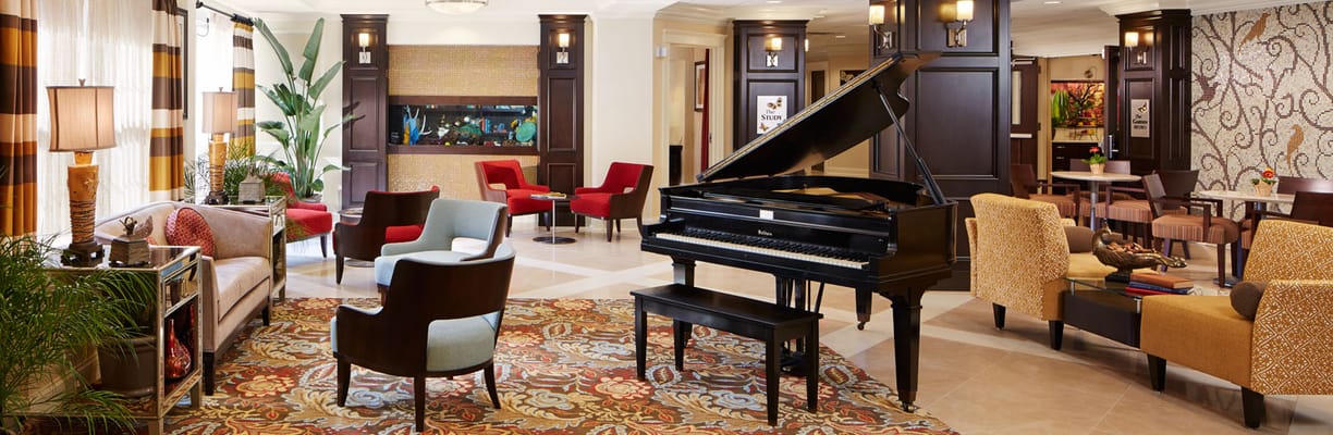 Elegant common area with piano and seating