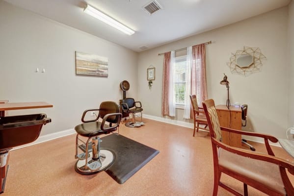 Interior view of a salon area with styling chairs and mirrors