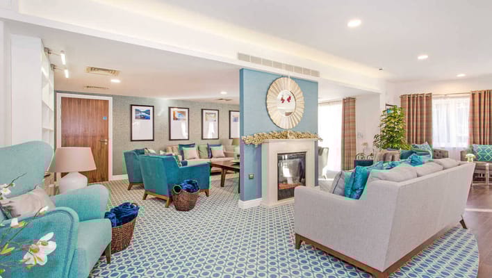 Cozy common area with comfortable seating and a fireplace