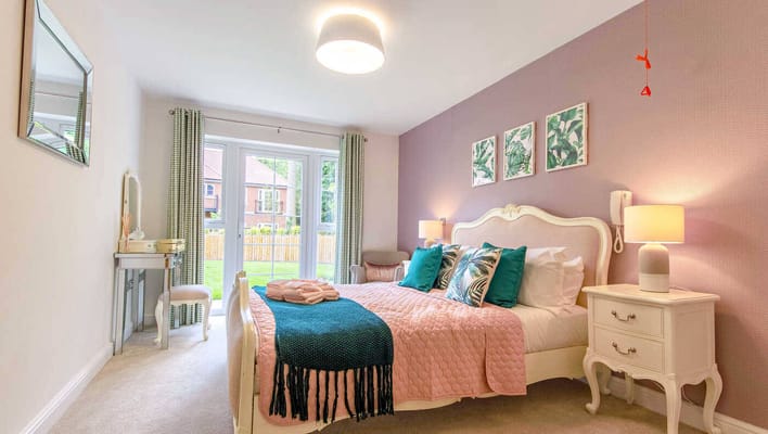 Cozy interior of a resident room with a bed and decor