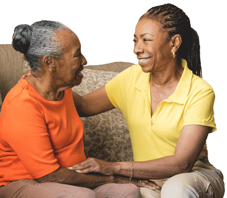 Two women sharing a joyful moment indoors
