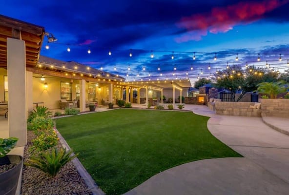 Outdoor courtyard with string lights and landscaped area