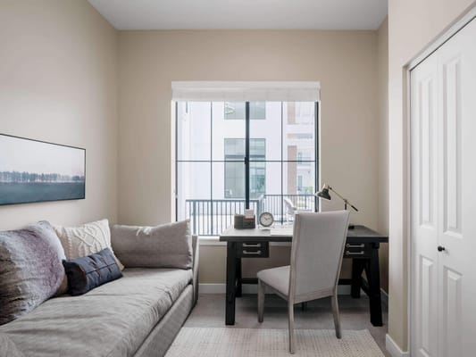 Cozy resident room with a couch and desk