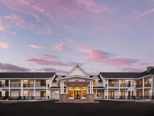 Exterior view of American Groves Senior Living at dusk