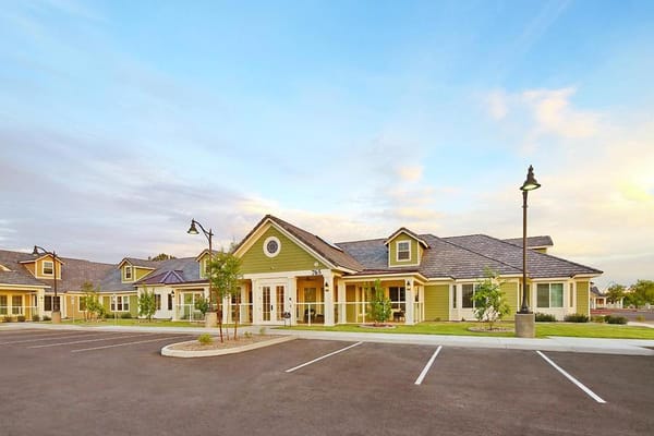 Exterior view of the facility with parking and landscaping