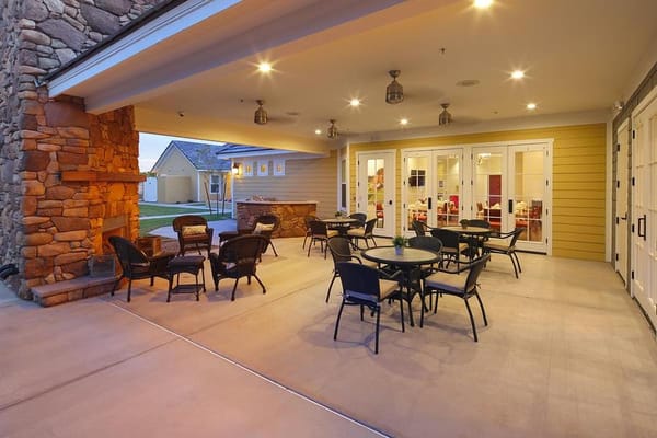 Exterior patio area with tables and chairs