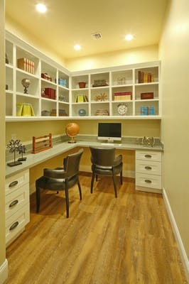 Bright study area with shelves and two chairs