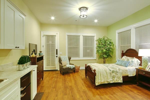 A cozy resident room with a bed and decoration