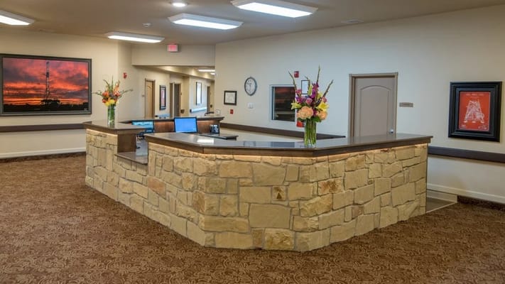 Interior view of a reception area with a stone counter