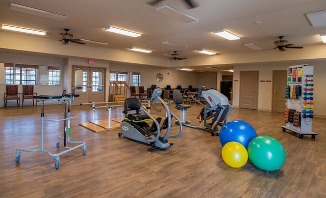 Interior fitness area with exercise equipment and balls