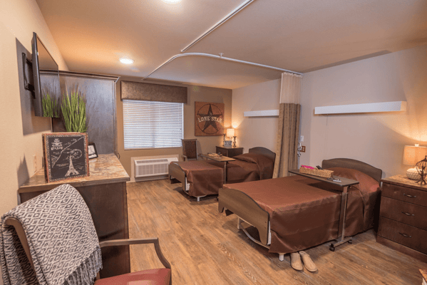 Private resident room with two beds and decor