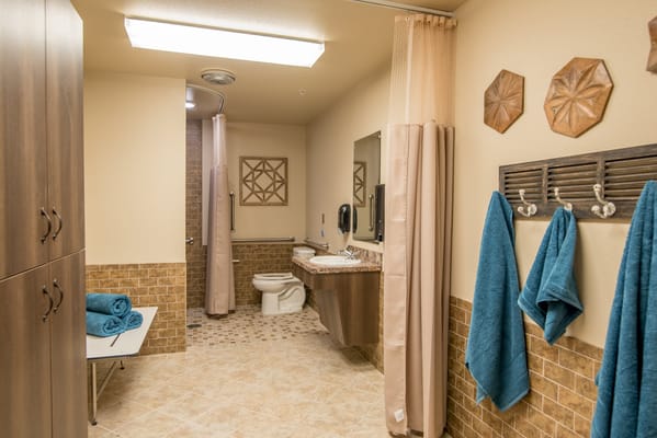 Well-lit bathroom with modern amenities