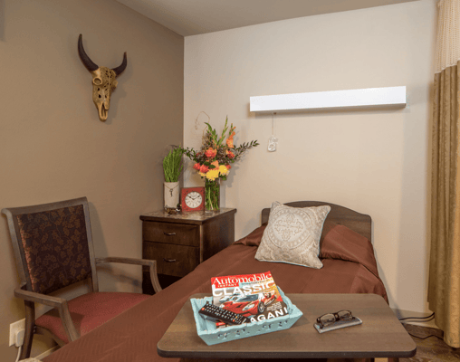 Cozy resident room with decor and comfortable furnishings